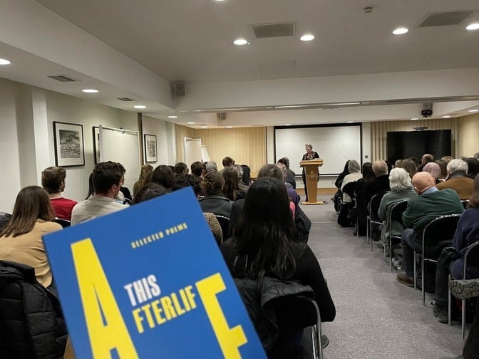 Meet the Poet 2023 speaker talking to audience 2 Poet speaking in Doctorow Hall to an audience of 60
